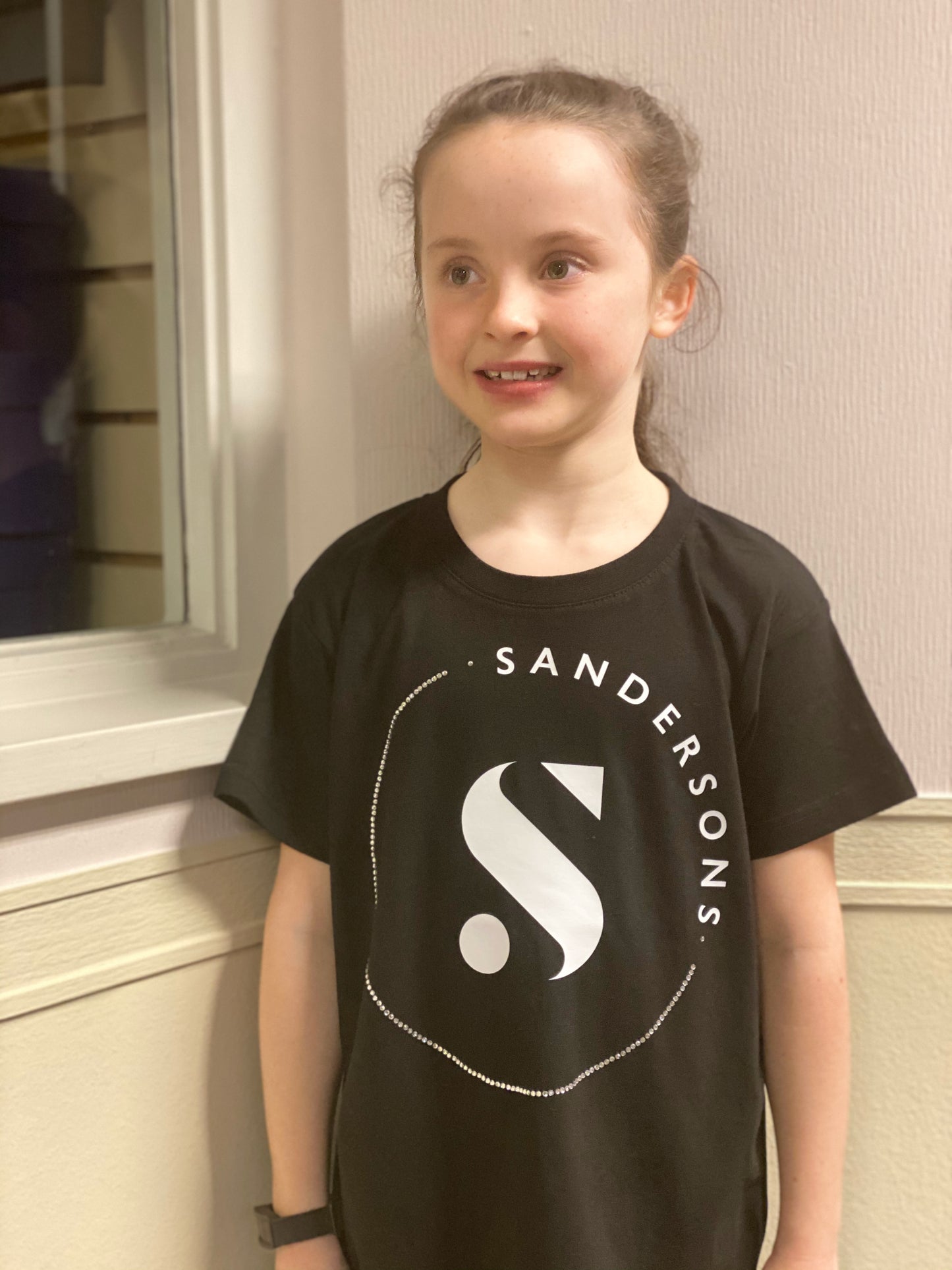 KIDS BLACK SANDERSONS T SHIRT BY AXZNT WITH LARGE WHITE PRINT & STONES