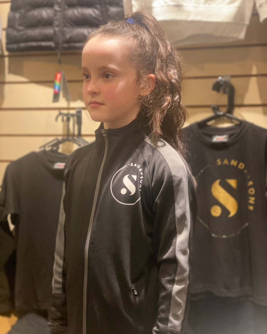 JACKET KIDS BLACK SANDERSONS SPORTS JACKET WITH GREY STRIPE WHITE LOGO ON FRONT & BACK
