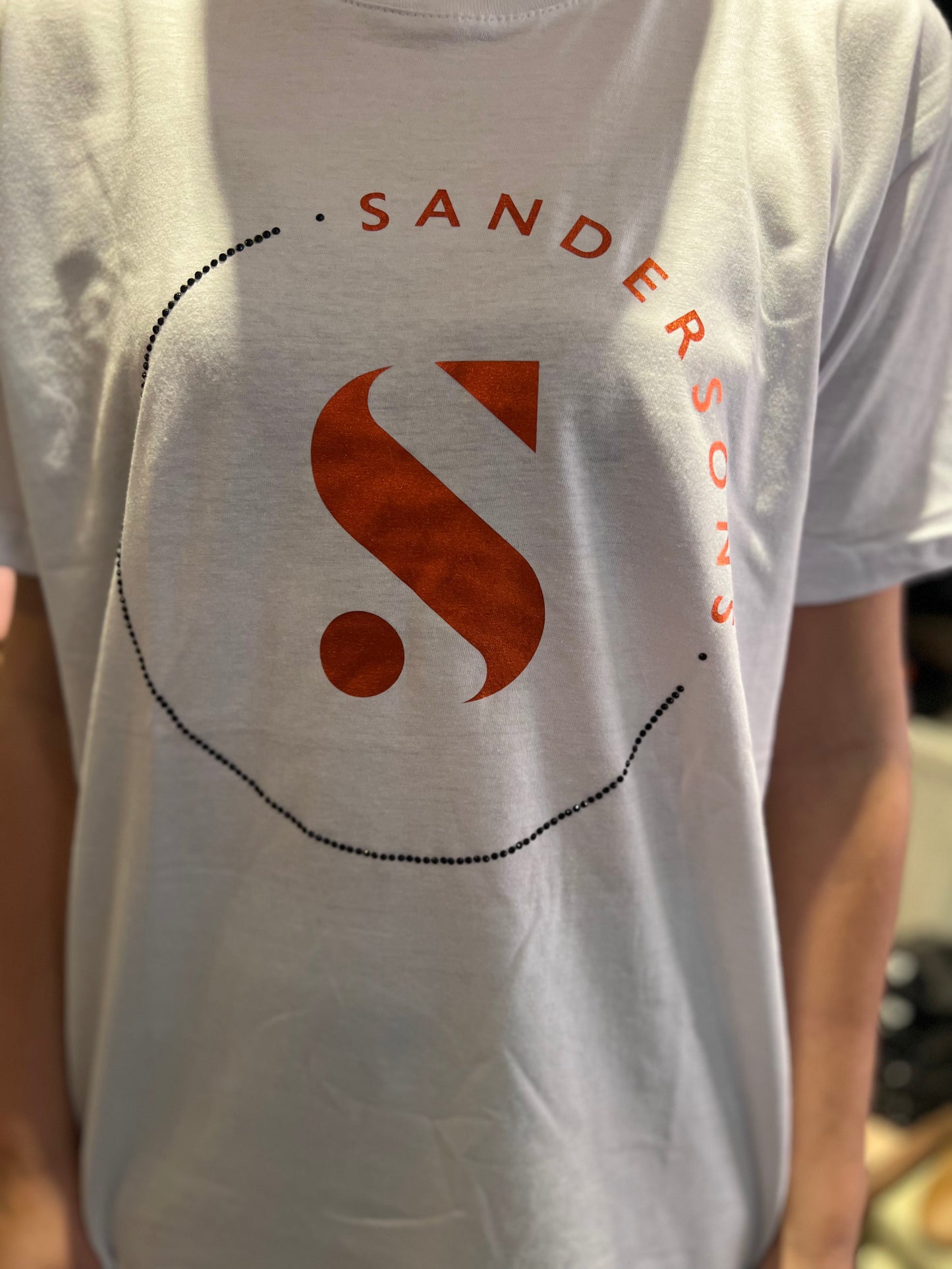 T SHIRT WHITE WITH BLACK CRYSTALS & METALLIC ORANGE LOGO- KIDS & ADULT WHITE SANDERSONS