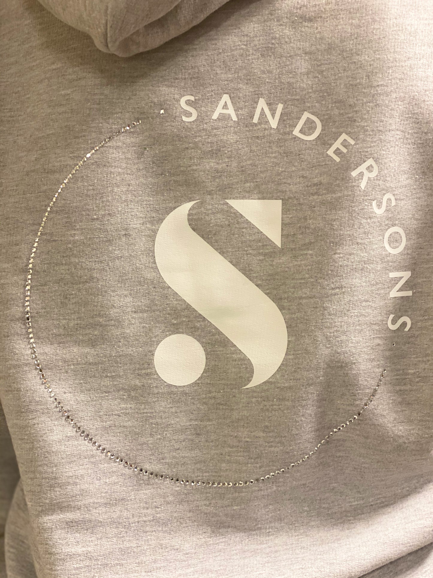 ADULT GREY SANDERSONS PULLOVER HOODIE BY AXZNT WITH WHITE BADGE PRINT AND LARGE WHITE/ SILVER PRINT & STONES